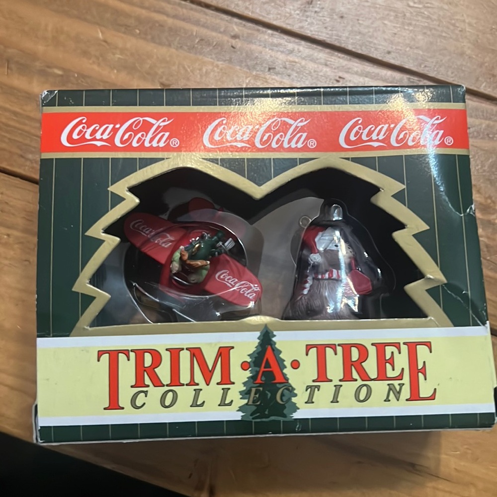 Vintage Coca-Cola trim, a tree ornaments.￼
Airplane and Dog, ornaments, 1996